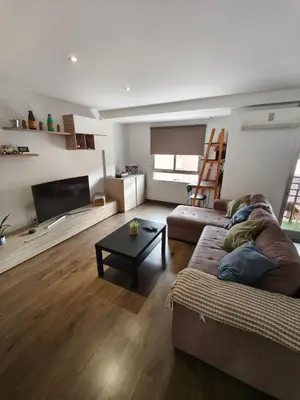 a living room with a couch and a table at Fabulous apartment in Valencia, Campanar in Valencia