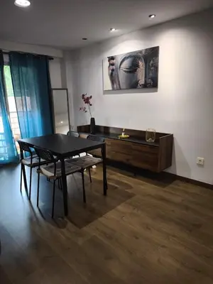 a living room with a black table and chairs at Fabulous apartment in Valencia, Campanar in Valencia