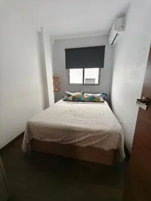 a bedroom with a large bed with a window at Fabulous apartment in Valencia, Campanar in Valencia