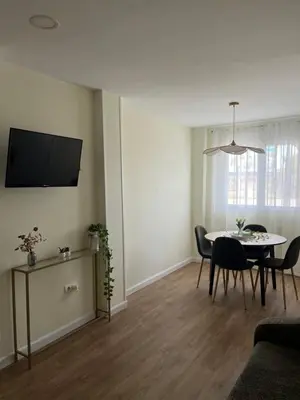 a living room with a couch and a table at Puzol Playa in Puzol