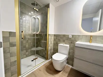 a bathroom with a toilet and a glass shower at Loft en el Centro De Valencia Botánico 1 in Valencia