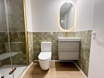 a bathroom with a toilet and a sink and a mirror at Loft en el Centro De Valencia Botánico 1 in Valencia