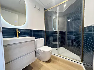 a bathroom with a toilet and a glass shower at Loft en el Centro De Valencia Botánico 4 in Valencia