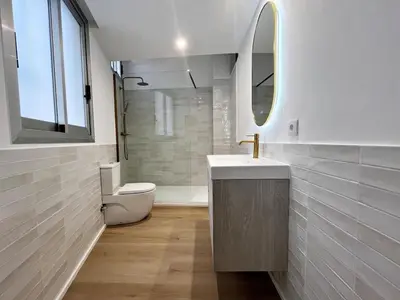 a bathroom with a sink and a toilet and a mirror at Loft en el Centro De Valencia Botánico 6 in Valencia