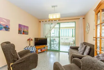 a living room with two couches and a tv at Apartment Patacona Beach 6 in Valencia