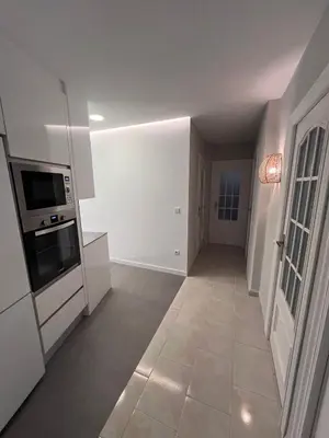 a kitchen with white appliances and a tile floor at Apartment Ruzafa Market I in Valencia