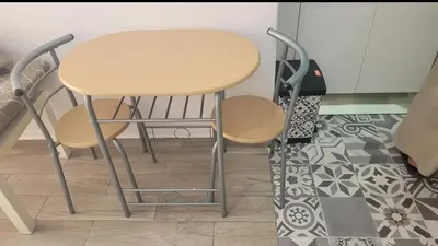 a small table and two chairs in a room at Valencia Room in Cuart de Poblet