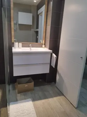a bathroom with a white sink and a mirror at Valencia Room in Cuart de Poblet