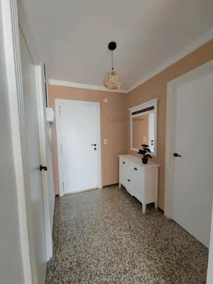 a room with a white door and a dresser and a mirror at Maravillosa vistal'mar in Puerto de Sagunto