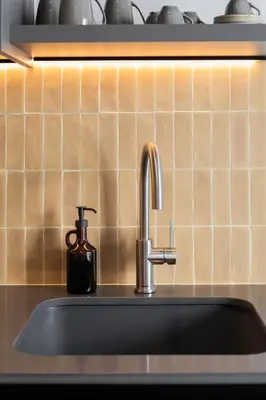 a kitchen sink with a soap dispenser next to it at Valencia Home Alfahuir in Valencia