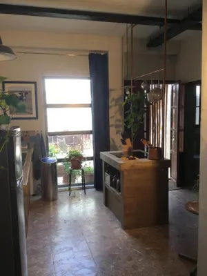 a kitchen with a window looking out at a patio at Stunning appartment for rent in Valencia in Valencia