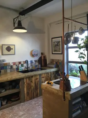 a living room with a wooden table and blue chairs at Stunning appartment for rent in Valencia in Valencia