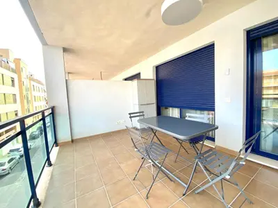 a balcony with a table and chairs on it at Dream Moncofar in Moncófar