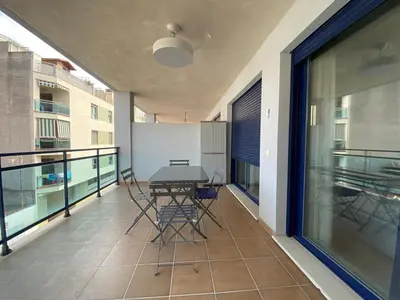 a balcony with a table and chairs on it at Dream Moncofar in Moncófar