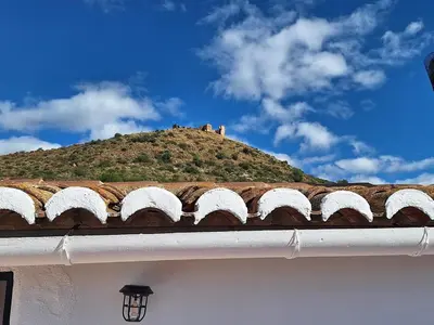 a view of a town with mountains in the background at Casa Trilles in Azuébar
