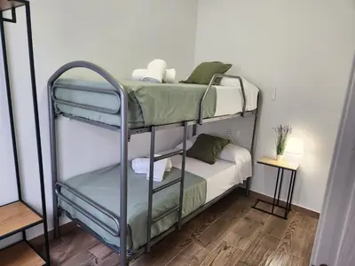 a couple of bunk beds in a room at Pinedo Playa Holiday in Valencia