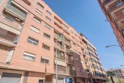 a brick building with a street light in front of it at Apartment Monfort in Valencia