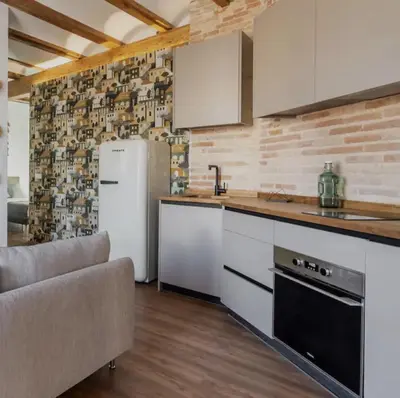 a kitchen with a refrigerator and a counter top at superincreible ubicación in Valencia