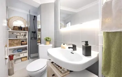 a white bathroom with a sink and a toilet at Marisol Molina in Sueca
