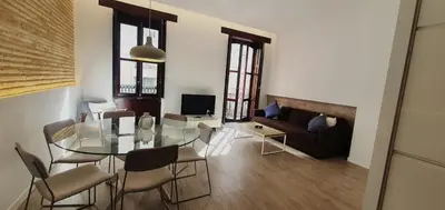 an open door in a room with a couch at Habitaciones VIP en Vivienda Lujo Muy Céntrica in Valencia
