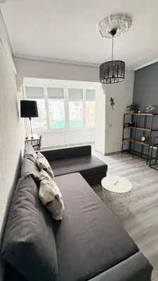 a living room with a couch and a table at Apartamento con piscina, playa y cerca de Valencia in Puebla de Farnals