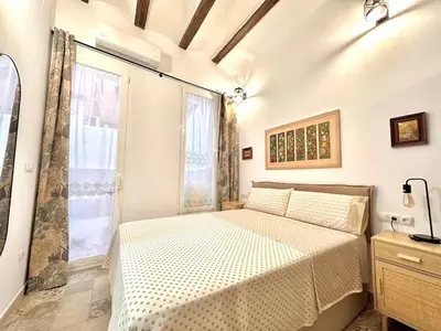 a bedroom with a bed and a window at Season apartment Cabañal in Valencia