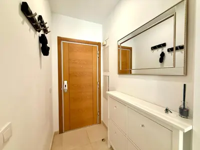 a bathroom with a mirror and a sink at Reinapart Patacona Beach Sunrise in Valencia