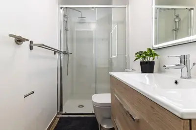 a bathroom with a shower and a sink and a toilet at Monte Alban Experience a unique place in Torrent