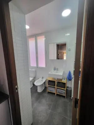 a bathroom with a sink and a toilet and a sink at Precioso apartamento en casa histórica en la playa in Valencia
