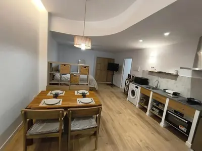 a living room with a couch and a table at estudio en El Castell in Burjasot