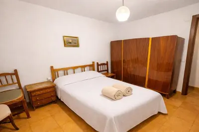 a bedroom with a bed with two towels on it at Winahost Casita Tavernes de Valldigna in Tavernes de Valldigna