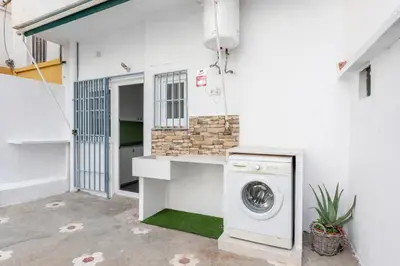 a washer and dryer sitting in a laundry room at Guest Ready - Bright flat well‑located urban stay in Valencia