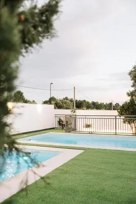 a swimming pool with a view of the water at Sierra Potosina Relájate en un entorno único in Torrent