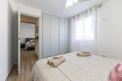 a bedroom with a large bed with two bags on it at Monte Taxco Escapada perfecta en un entorno único in Torrent