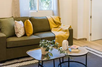 a living room with a couch and a table at Monte Taxco Escapada perfecta en un entorno único in Torrent