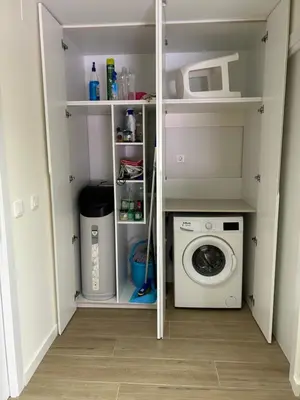 a closet with white shelves and white drawers at Lorenzo in Benaguacil