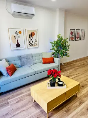 a living room with a couch and a coffee table at Stylish Bright Centrally Located Home El Botanic in Valencia