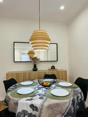 a bedroom with a large bed with a wooden floor at Stylish Bright Centrally Located Home El Botanic in Valencia