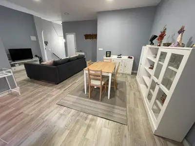 a living room with a table and a couch at Cabañal Flat, Wi-Fi & AACC in Valencia