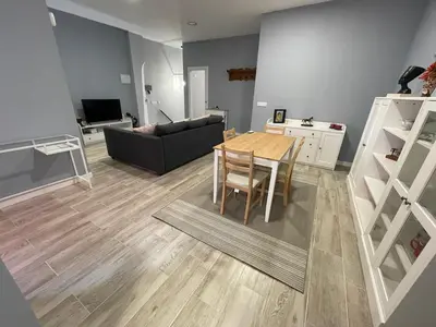a living room with a table and a couch at Cabañal Flat, Wi-Fi & AACC in Valencia