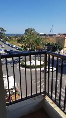 a balcony with a view of a parking lot at Charming beachfront apartment in Puerto de Sagunto