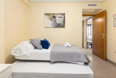 a bedroom with a large bed with at Patacona Azud in Valencia
