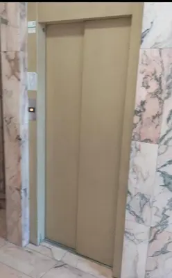 a door in a room with a marble wall at Studio with garden views in Valencia