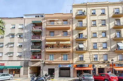 a parking garage with two cars parked in it at Apartment Ruzafa Zapadores in Valencia