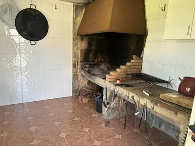 a kitchen with a brick oven in a kitchen at Villa Noelia in Turís