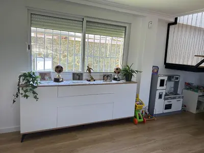 a kitchen with a white counter and a window at Villa Noelia in Turís