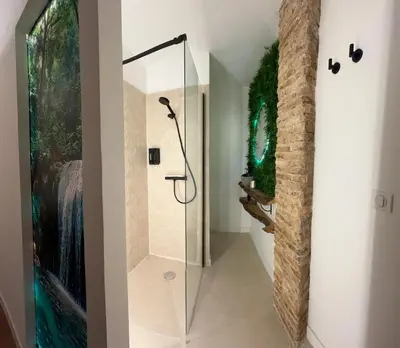 a bathroom with a shower with a glass door at Fuera de tiempo in Albalat de la Ribera