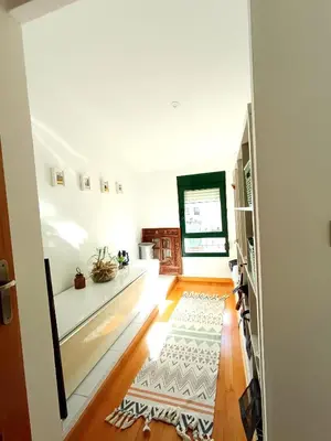 a large kitchen with wooden cabinets and a stove at La Llar del Magraner in Barraca de Aguas Vivas