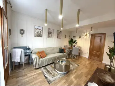a living room with a couch and a table at Nuevo, centrico y luminoso Apartamento casaslacambra in Valencia