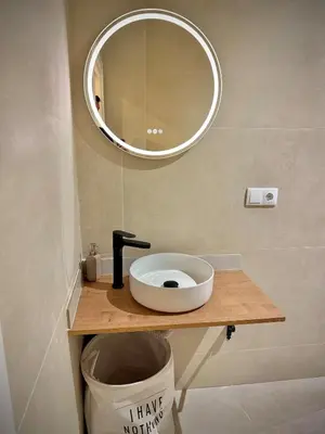 a bathroom with a sink and a mirror at Glamour Suite1 next to Plaza de España in Valencia